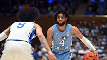 Mar 9, 2024; Durham, North Carolina, USA; North Carolina Tar Heels guard RJ Davis (4) controls the ball in front of Duke Blue Devils guard Tyrese Proctor (5) during the first half at Cameron Indoor Stadium. Mandatory Credit: Rob Kinnan-Imagn Images