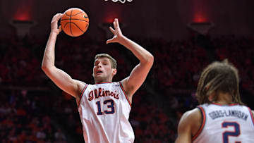 Jan 11, 2025; Champaign, Illinois, USA;  Illinois Fighting Illini center Tomislav Ivisic (13) grabs a rebound during the second half against the USC Trojans at State Farm Center. Mandatory Credit: Ron Johnson-Imagn Images