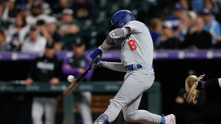 Los Angeles Dodgers right fielder Enrique Hernandez (8) hits a single in the sixth inning against the Colorado Rockies at Coors Field in 2023.