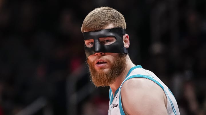 Apr 10, 2024; Atlanta, Georgia, USA; Charlotte Hornets forward Davis Bertans (9) shown on the court wearing a mask against the Atlanta Hawks during the first half at State Farm Arena. Mandatory Credit: Dale Zanine-USA TODAY Sports