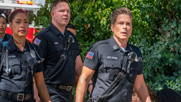 9-1-1: LONE STAR: L-R: Gina Torres, Jim Parrack and Rob Lowe in the “Down To Clown” episode of 9-1-1: LONE STAR airing Monday, April 25 (9:00-10:00 PM ET/PT) on FOX. © 2022 Fox Media LLC. CR: Jack Zeman/FOX.