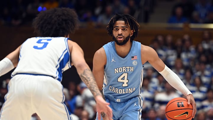 Mar 9, 2024; Durham, North Carolina, USA; North Carolina basketball  guard RJ Davis (4) controls the ball in front of Duke basketball guard Tyrese Proctor (5) during the first half at Cameron Indoor Stadium.