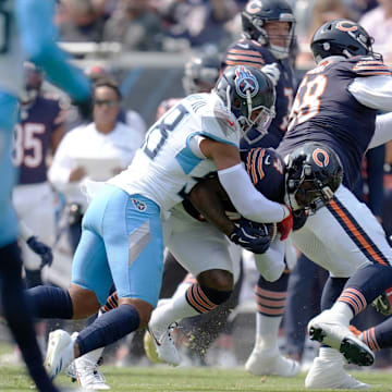 Harold Landry III brings down D'Andre Swift in the first quarter of the season opener.