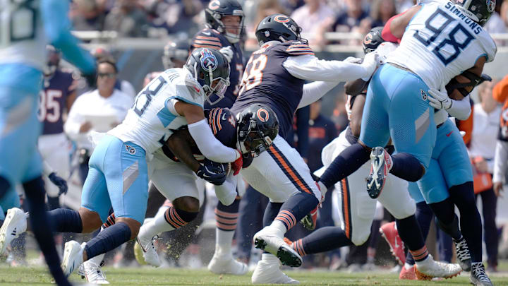 Harold Landry III brings down D'Andre Swift in the first quarter of the season opener.