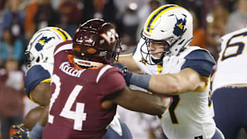 Sep 22, 2022; Blacksburg, Virginia, USA;  West Virginia Mountaineers wide receiver Cortez Braham (11) blocks Virginia Tech Hokies linebacker Jaden Keller (24) during the second quarter at Lane Stadium. Mandatory Credit: Reinhold Matay-Imagn Images