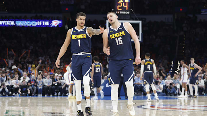 Mar 10, 2025; Oklahoma City, Oklahoma, USA; Denver Nuggets forward Michael Porter Jr. (1) and center Nikola Jokic (15) talk during a time out against the Oklahoma City Thunder during the second half at Paycom Center. Mandatory Credit: Alonzo Adams-Imagn Images Mar 10, 2025; Oklahoma City, Oklahoma, USA; Denver Nuggets forward Michael Porter Jr. (1) and center Nikola Jokic (15) talk during a time out against the Oklahoma City Thunder during the second half at Paycom Center. Mandatory Credit: Alonzo Adams-Imagn Images