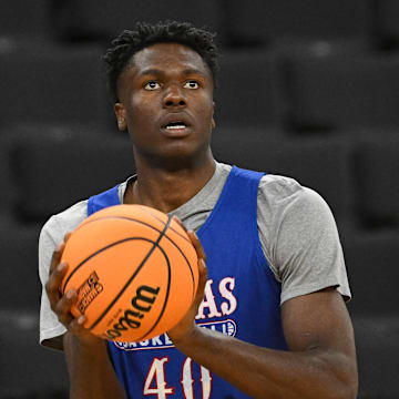 Mar 19, 2025; Providence, RI, USA; Kansas Jayhawks forward Flory Bidunga (40)  practices at Amica Mutual Pavilion. Mandatory Credit: Eric Canha-Imagn Images