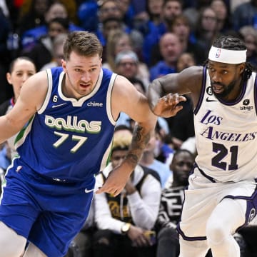 Dec 25, 2022; Dallas, Texas, USA; Dallas Mavericks guard Luka Doncic (77) and Los Angeles Lakers guard Patrick Beverley (21) in action during the game between the Dallas Mavericks and the Los Angeles Lakers at American Airlines Center. Mandatory Credit: Jerome Miron-USA TODAY Sports