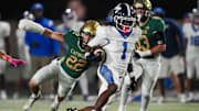 Knoxville Catholic's George Mancini (22) runs after McCallie's Keeyshawn Tabuteau (1) during a TSSAA high school football game between Knoxville Catholic and McCallie on Oct. 17, 2025.