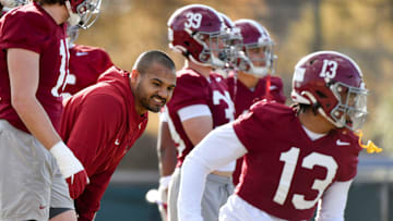 Mar 6, 2024; Tuscaloosa, Alabama, USA; Outside linebackers coach Christian Robinson works with his players during practice for the Alabama Crimson Tide football team Wednesday.