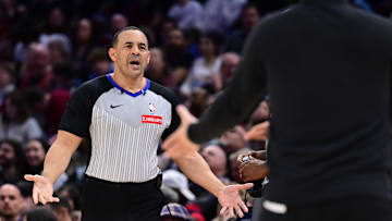 Mar 30, 2025; Cleveland, Ohio, USA; Referee Curtis Blair (74) argues a call with Los Angeles Clippers head coach Tyronn Lue during the second half against the Cleveland Cavaliers at Rocket Arena. Mandatory Credit: Ken Blaze-Imagn Images
