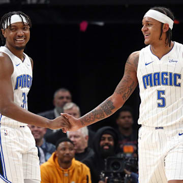 Orlando Magic center Wendell Carter Jr. (34) reacts with forward Paolo Banchero (5) after a block by Banchero during the first half against the Memphis Grizzlies at FedExForum. 