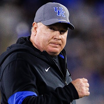 Oct 26, 2024; Lexington, Kentucky, USA; Kentucky Wildcats head coach Mark Stoops runs onto the field before the game against the Auburn Tigers at Kroger Field. Mandatory Credit: Jordan Prather-Imagn Images