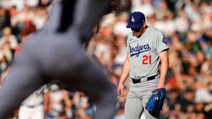 Jun 18, 2024; Denver, Colorado, USA; Los Angeles Dodgers starting pitcher Walker Buehler (21) reacts after giving up a hit in the first inning against the Colorado Rockies at Coors Field. Mandatory Credit: Isaiah J. Downing-USA TODAY Sports
