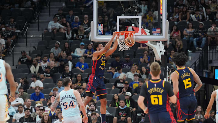 Mar 30, 2025; San Antonio, Texas, USA; Golden State Warriors forward Trayce Jackson-Davis (32) dunks the ball in front of San Antonio Spurs forward Sandro Mamukelashvili (54) in the second half at Frost Bank Center. Mandatory Credit: Daniel Dunn-Imagn Images Mar 30, 2025; San Antonio, Texas, USA; Golden State Warriors forward Trayce Jackson-Davis (32) dunks the ball in front of San Antonio Spurs forward Sandro Mamukelashvili (54) in the second half at Frost Bank Center. Mandatory Credit: Daniel Dunn-Imagn Images