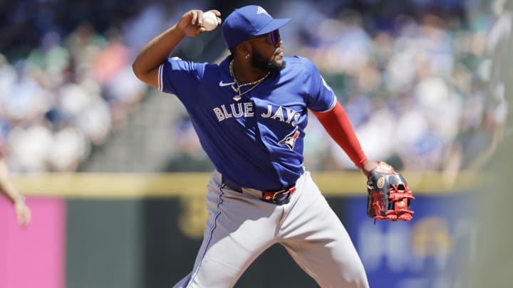 Jul 7, 2024; Seattle, Washington, USA; Toronto Blue Jays third baseman Vladimir Guerrero Jr. (27) throws out Seattle Mariners first baseman Ty France (23) during the fourth inning at T-Mobile Park.