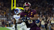 Oct 5, 2024; Tempe, Arizona, USA; Arizona State Sun Devils wide receiver Jordyn Tyson (0) celebrates after scoring a touchdown against the Kansas Jayhawks at Mountain America Stadium. Mandatory Credit: Mark J. Rebilas-Imagn Images