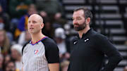 Feb 2, 2022; Salt Lake City, Utah, USA;  Referee Eric Dalen (37) and Utah Jazz assistant coach Alex Jensen speak during a third quarter break in action at Vivint Arena. Mandatory Credit: Rob Gray-Imagn Images