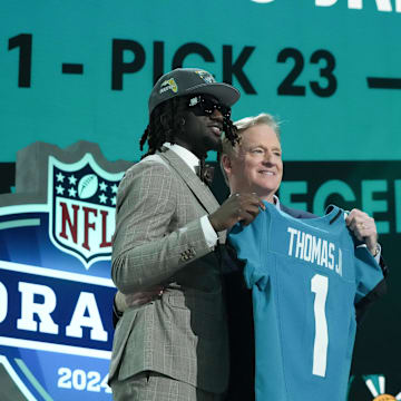 Apr 25, 2024; Detroit, MI, USA; LSU Tigers wide receiver Brian Thomas Jr. poses with NFL commissioner Roger Goodell after being selected by the Jacksonville Jaguars as the No. 23 pick during the first round of the 2024 NFL Draft at Campus Martius Park and Hart Plaza. Mandatory Credit: Kirby Lee-Imagn Images