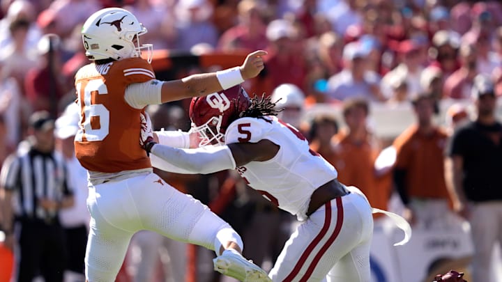 Oklahoma Sooners linebacker Kendal Daniels pressures Texas Longhorns quarterback Arch Manning in the first half of the Red River Rivalry