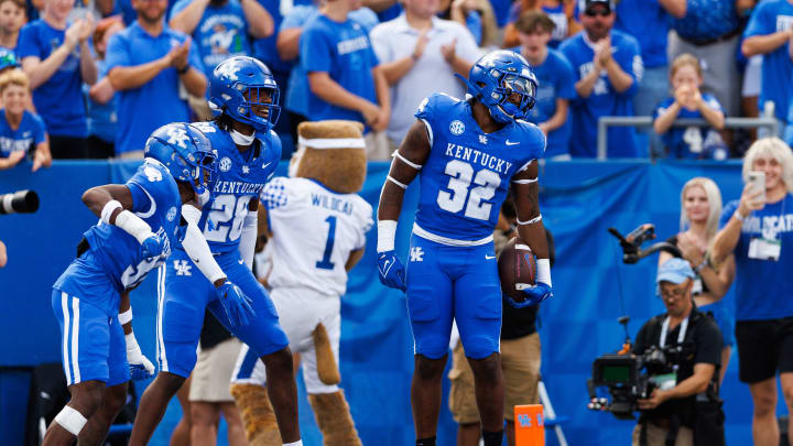 Sep 30, 2023; Lexington, Kentucky, USA; Kentucky Wildcats linebacker Trevin Wallace (32) celebrates an interception during the first quarter against the Florida Gators at Kroger Field. 