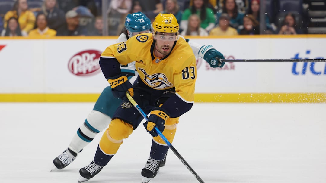 Apr 13, 2026; Nashville, Tennessee, USA; Nashville Predators defenseman Adam Wilsby (83) moves the puck during the third period of their game against the San Jose Sharks at Bridgestone Arena. Mandatory Credit: Alan Poizner-Imagn Images