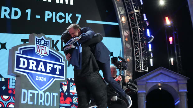 Alabama Crimson Tide offensive lineman JC Latham picks up commissioner Roger Goodell at the 2024 NFL Draft