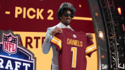 Apr 25, 2024; Detroit, MI, USA; LSU Tigers quarterback Jayden Daniels poses after being selected by the Washington Commanders as the No. 2 pick in the first round of the 2024 NFL Draft at Campus Martius Park and Hart Plaza. Mandatory Credit: Kirby Lee-USA TODAY Sports