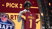 LSU Tigers quarterback Jayden Daniels poses after being selected by the Washington Commanders as the No. 2 pick of the 2024 NFL draft.
