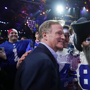 NFL commissioner Roger Goodell poses with fans during the 2024 NFL Draft at Campus Martius Park and Hart Plaza. 