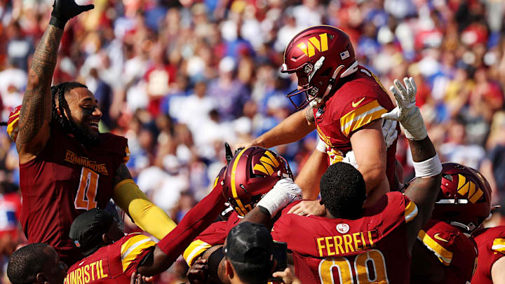 Sep 15, 2024; Landover, Maryland, USA; Washington Commanders place kicker Austin Seibert (3) celebrates with his teammates after making the game winning field goal against the New York Giants at Commanders Field.  