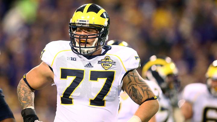 Dec 28, 2013; Tempe, AZ, USA; Michigan Wolverines offensive lineman Taylor Lewan (77) against the Kansas State Wildcats during the Buffalo Wild Wings Bowl at Sun Devil Stadium. Mandatory Credit: Mark J. Rebilas-USA TODAY Sports