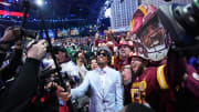 Apr 25, 2024; Detroit, MI, USA; LSU Tigers quarterback Jayden Daniels poses with fans after being