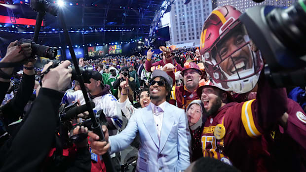 Washington Commanders quarterback Jayden Daniels with fans.