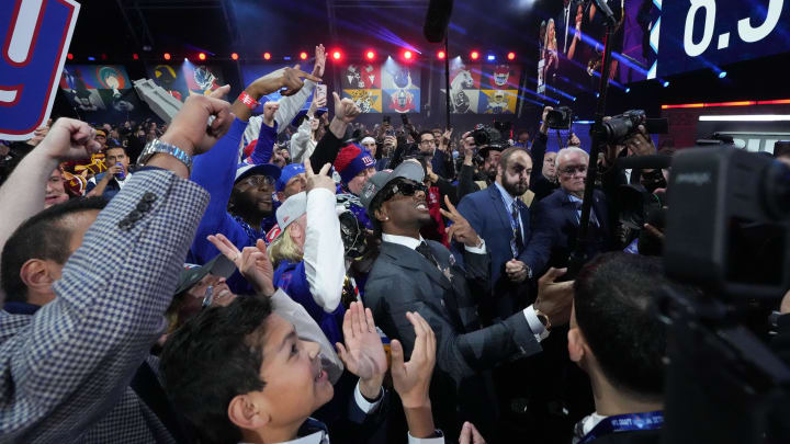 Apr 25, 2024; Detroit, MI, USA; LSU Tigers wide receiver Malik Nabers poses with fans after being selected by the New York Giants as the No. 6 pick in the first round of the 2024 NFL Draft at Campus Martius Park and Hart Plaza.  