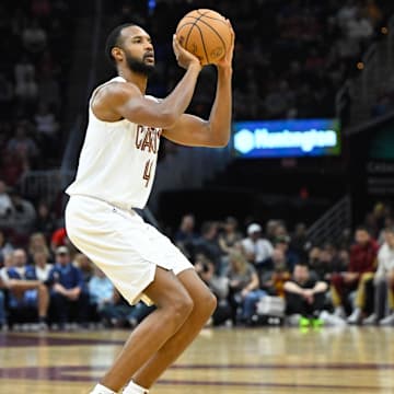 Apr 14, 2024; Cleveland, Ohio, USA; Cleveland Cavaliers forward Evan Mobley (4) attempts a three-point basket in the second quarter against the Charlotte Hornets at Rocket Mortgage FieldHouse. Mandatory Credit: David Richard-USA TODAY Sports