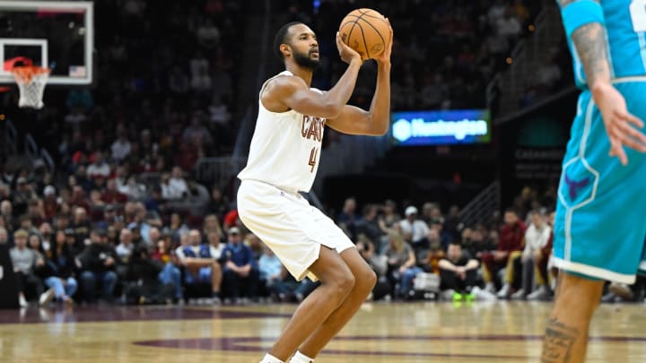 Apr 14, 2024; Cleveland, Ohio, USA; Cleveland Cavaliers forward Evan Mobley (4) attempts a three-point basket in the second quarter against the Charlotte Hornets at Rocket Mortgage FieldHouse. Mandatory Credit: David Richard-USA TODAY Sports