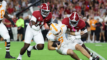 Oct 18, 2025; Tuscaloosa, Alabama, USA; Tennessee Volunteers quarterback Joey Aguilar (6) is sacked by Alabama Crimson Tide linebacker Yhonzae Pierre (42) during the first quarter at Saban Field at Bryant-Denny Stadium. Mandatory Credit: David Leong-Imagn Images