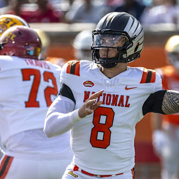 Feb 1, 2025; Mobile, AL, USA; National team quarterback Dillon Gabriel of Oregon (8) throws the ball against the American team during the first half at Hancock Whitney Stadium. Mandatory Credit: Vasha Hunt-Imagn Images