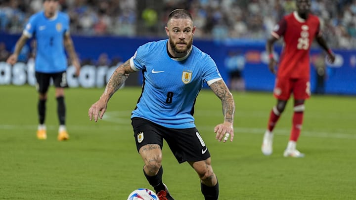 Jul 13, 2024; Charlotte, NC, USA; Uruguay midfielder Nahitan Nandez (8) brings the ball up field against Canada.