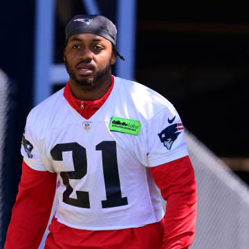 Jun 10, 2024; Foxborough, MA, USA; New England Patriots running back Antonio Gibson (21) walks to the practice fields for minicamp at Gillette Stadium. Mandatory Credit: Eric Canha-USA TODAY Sports