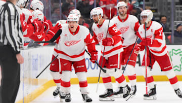 Feb 4, 2025; Seattle, Washington, USA; Detroit Red Wings right wing Jonatan Berggren (48) celebrates with the bench after scoring a goal against the Seattle Kraken during the second period at Climate Pledge Arena. Mandatory Credit: Steven Bisig-Imagn Images