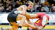 Iowa’s Angelo Ferrari wrestles Iowa State’s Evan Bockman in an 184-pound match during the Cy-Hawk wrestling dual on Saturday, Nov. 23, 2024, at Carver-Hawkeye Arena in Iowa City, Iowa.