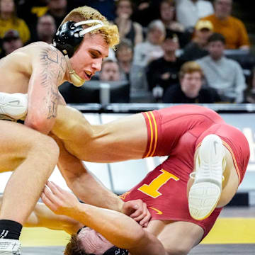 Iowa’s Angelo Ferrari wrestles Iowa State’s Evan Bockman in an 184-pound match during the Cy-Hawk wrestling dual on Saturday, Nov. 23, 2024, at Carver-Hawkeye Arena in Iowa City, Iowa.