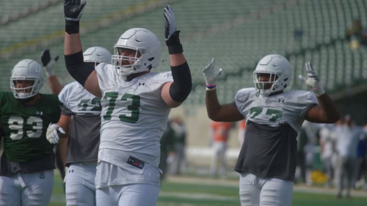 Colorado State football players Oliver Jervis (73) and Saveyon Henderson (77) celebrate a touchdown during a scrimmage Saturday, April 15, 2023.