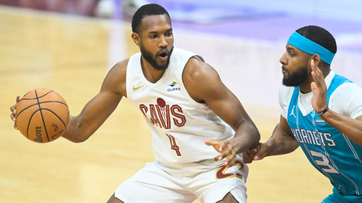 Apr 14, 2024; Cleveland, Ohio, USA; Cleveland Cavaliers forward Evan Mobley (4) dribbles against Charlotte Hornets center Marques Bolden (3) in the first quarter at Rocket Mortgage FieldHouse. Mandatory Credit: David Richard-USA TODAY Sports