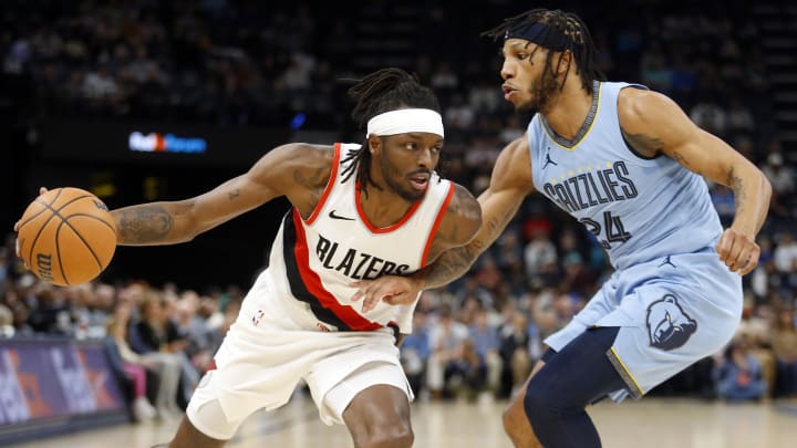 Mar 2, 2024; Memphis, Tennessee, USA; Portland Trail Blazers forward Jerami Grant (9) drives to the basket as Memphis Grizzlies forward Lamar Stevens (24) defends during the first half at FedExForum. Mandatory Credit: Petre Thomas-USA TODAY Sports