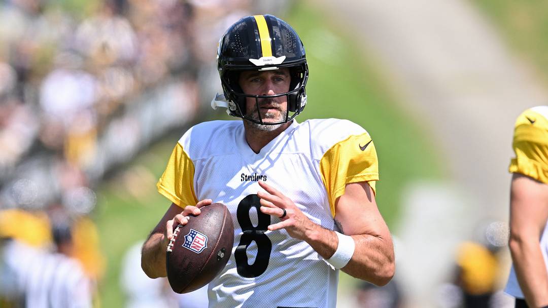 Aug 03, 2026; Latrobe, PA, USA;   Pittsburgh Steelers quarterbacks Aaron Rodgers (8) looks to throw a pass as Will Howard (18) watches during a practice session at Training camp at Saint Vincent College. Mandatory Credit: Barry Reeger-Imagn Images