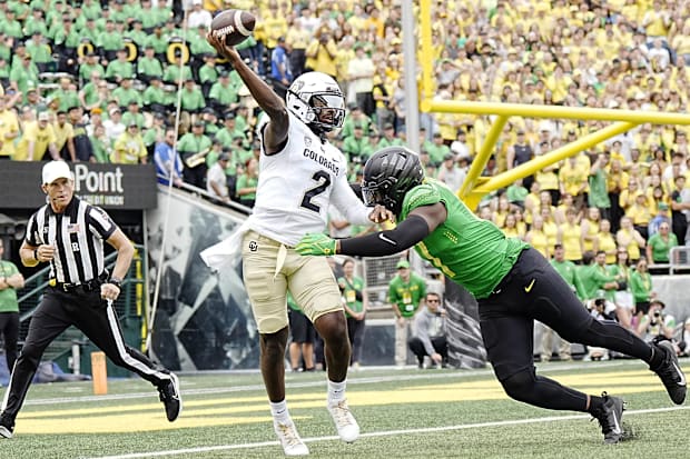 Sep 23, 2023; Eugene, Oregon, USA; Colorado Buffaloes quarterback Shedeur Sanders (2) throws a pass while under pressure from