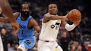 Feb 8, 2025; Inglewood, California, USA;  Utah Jazz guard Isaiah Collier (13) passes the ball against Los Angeles Clippers guard James Harden (1) during the first quarter at Intuit Dome. Mandatory Credit: Kiyoshi Mio-Imagn Images